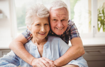 Senior couple with perfect smiles.