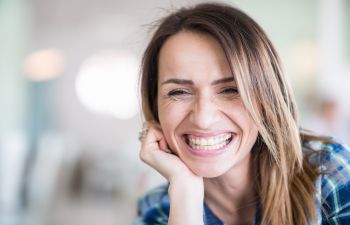 Happy woman showing perfect teeth in her smile.
